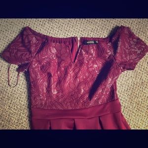 Knee length burgundy dress.